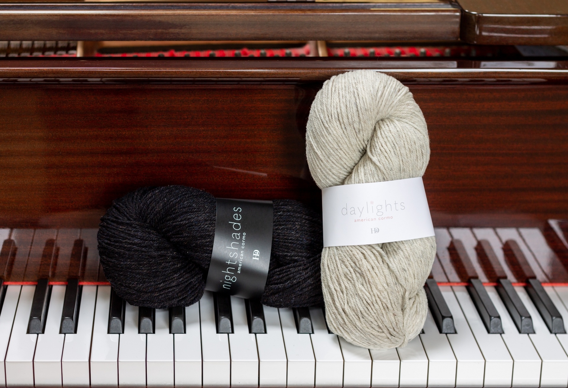 Harrisville Designs on the piano – nightshades in stiletto and daylights in lint flat L