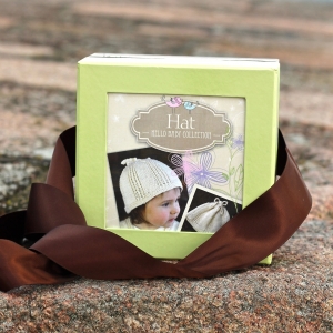 Appalachian Baby hello baby hat kit on beach wall by Fig Tree Yarns